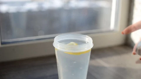 Water with fruit shakes in the shaker Stock Footage 76159839
