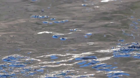 Water games of a small waterfall in a mountain stream in winter Stock Footage 100674230