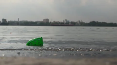 The water of the Ganges River is being polluted due to the dumping of waste. Stock Footage 340776627