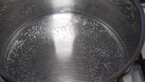 Water getting boiled in the pan. 20x fast Stock Footage 100670174