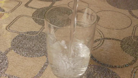 Water in a glass Stock Footage 147919396