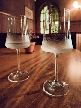 Water glasses on solid wood table Stock Photos