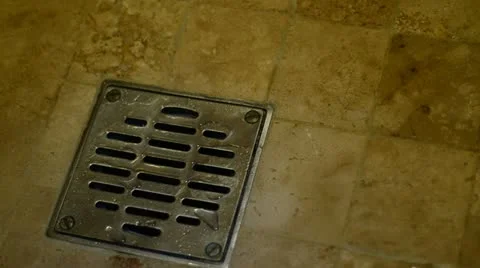 Water going down a shower drain Stock Footage 10877018