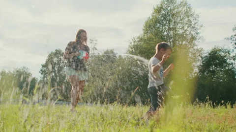 Water gun games in the backyard Stock-Footage 248755830