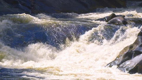 Water gushing in the river Stock Footage 103823636