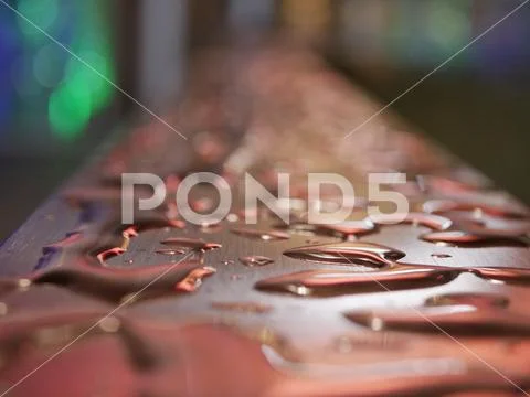 Water on hand rail in shopping centre macro lens Stock Photos