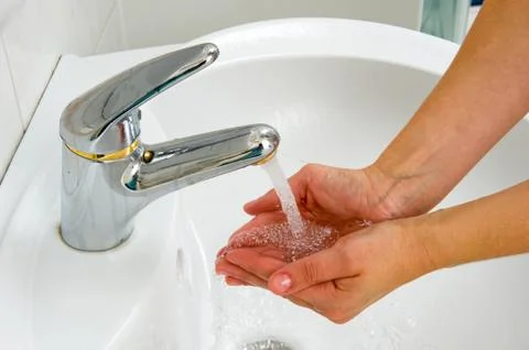 Water in hands Stock Photos
