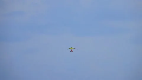 Water hang glider flies in the clouds Stock Footage 97058342