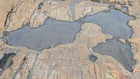 Water has collected on the rock's surface. Stock Footage 291629437