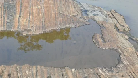 Water has collected on the rock's surface. Stock Footage 291629989