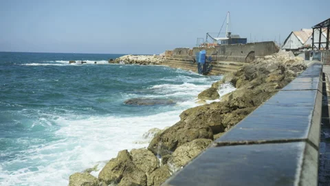 Water Hitting Rocks on a Mediterranean Shore Stock Footage 88887066