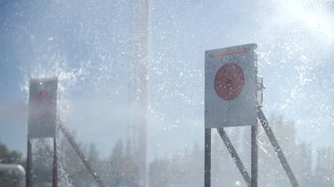 Water hitting training targets during firefighting drill Stock Footage 321314278