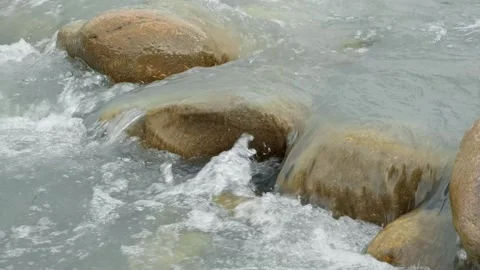 Water intensive flow close-up in mountain river with stones Stock Footage 301420978