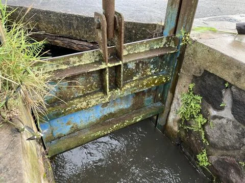 Water irrigation gate to adjust the flow of water Stock Photos
