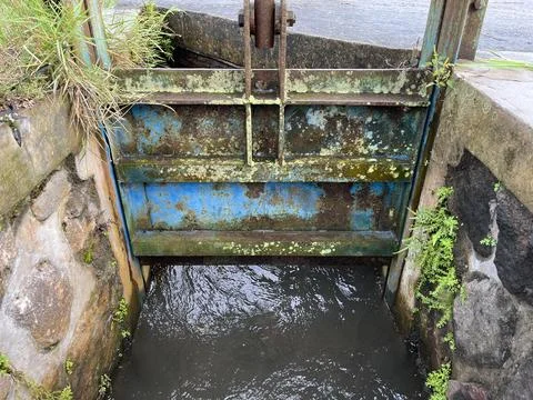 Water irrigation gate to adjust the flow of water Stock Photos