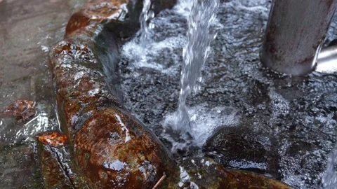 Water jet falling into a stone basin Stock Footage 330081467