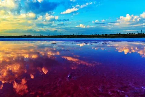 Water landscape of the reflected cloudy sky Stock Photos