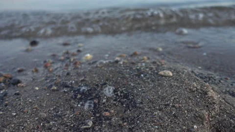 Water lapping against a Beach Stock Footage 137431104