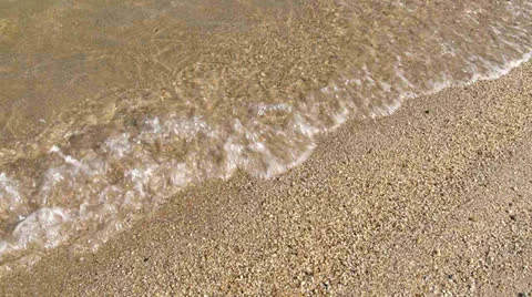 Water lapping beach closeup 스톡 동영상 23116458