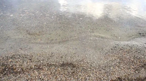 Water lapping on the sandy beach 库存影片 45357559