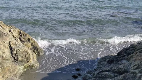 Water lapping at tiny entrance at Willow's Beach Stock Footage 190824423