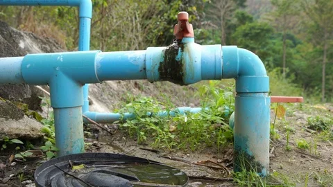 Water leak from the pipe in forest Stock Footage 101018912