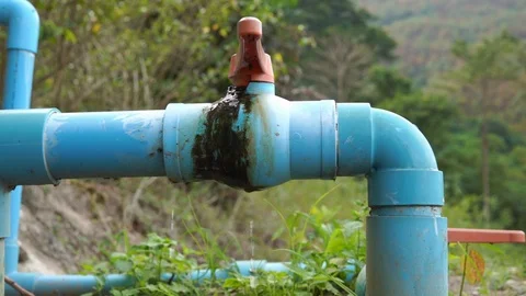 Water leak from the pipe in forest, slow motion Stock Footage 101018826