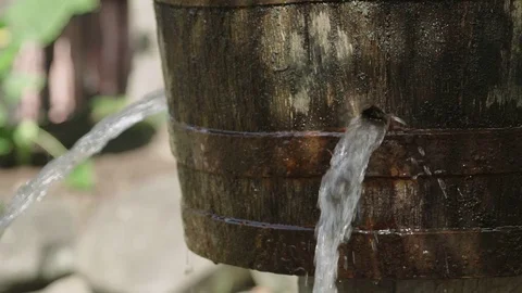 Water leaking from bucket 4k Stock Footage 76816829