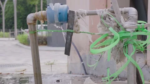 Water leaking constantly through a pipeline Stock Footage 139898596