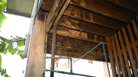 Water leaking form under a Thai house,Thailand. Stock Footage 50643217