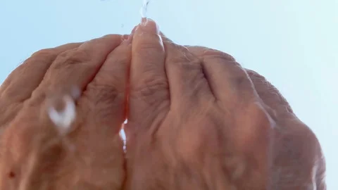 Water leaking from hands Stock Footage 129237796