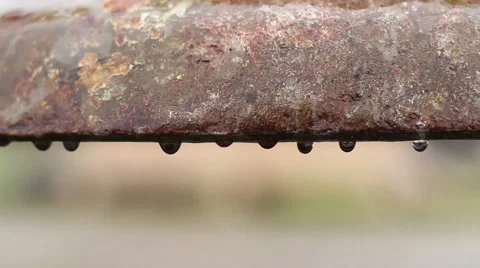 Water leaking from old pipe, rust corroding metal surface, ancient utilities Stock Footage
