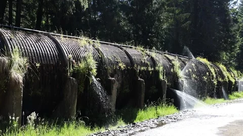 Water leaking from a pipe on Rogue Umpqua highway Oregon USA Stock Footage 340243239