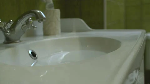 Water leaking from the sink Stock Footage 131328035