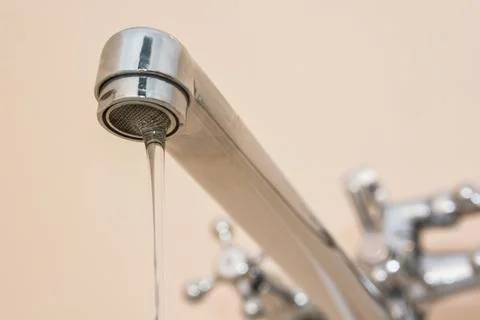Water leaking from tap Stock Photos