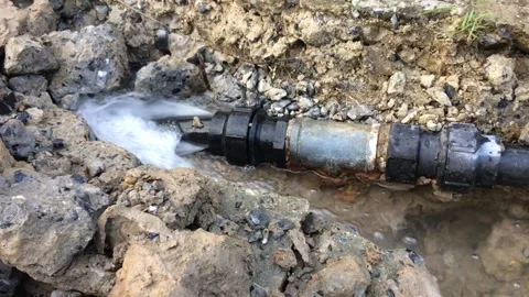 Water leaks due to broken underground plumbing. Stock Footage 137782157