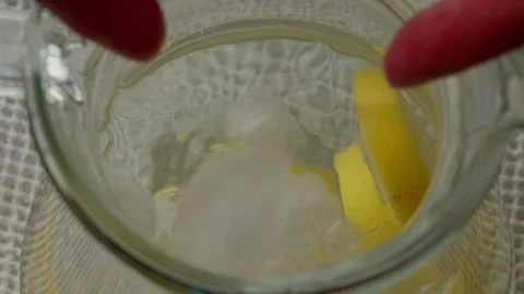 Water with lemon and ice cubes Stock Footage 313622067