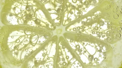 Water with Lemon Slices and exploding soda, air bubbles. Refreshing soft drink Stock Footage 175657841