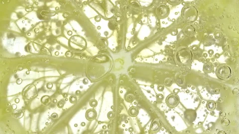 Water with Lemon Slices and exploding soda, air bubbles. Refreshing soft drink Stock Footage 186738826