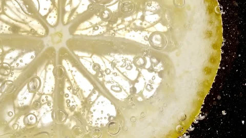 Water with Lemon Slices and exploding soda, air bubbles. Refreshing soft drink Stock Footage 194474879