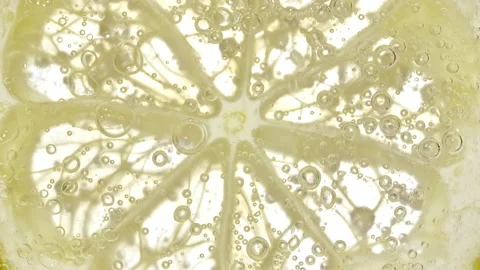 Water with Lemon Slices and exploding soda, air bubbles. Refreshing soft drink Stock Footage 195289821