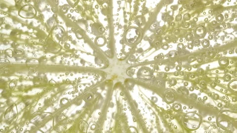 Water with Lemon Slices and exploding soda, air bubbles. Refreshing soft drink Stock Footage 195290161