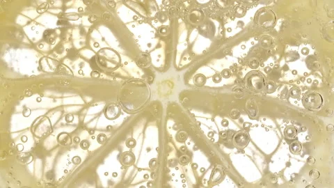 Water with Lemon Slices and exploding soda, air bubbles. Refreshing soft drink Stock Footage 196822474