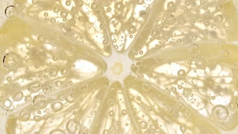 Water with Lemon Slices and exploding soda, air bubbles. Refreshing soft drink Stock Footage 196981732