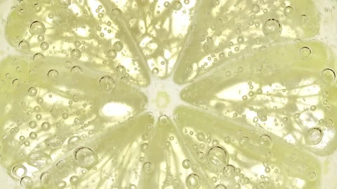 Water with Lemon Slices and exploding soda, air bubbles. Refreshing soft drink Stock Footage 197117765