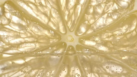 Water with Lemon Slices and exploding soda, air bubbles. Refreshing soft drink Stock Footage 200838689