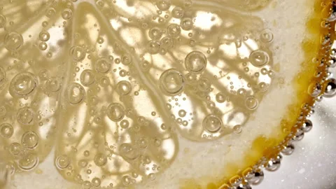 Water with Lemon Slices and exploding soda, air bubbles. Refreshing soft drink Stock Footage 201592782