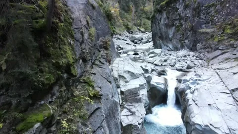 Water level pan from gorge channel to waterfall pool Stock Footage 331900800