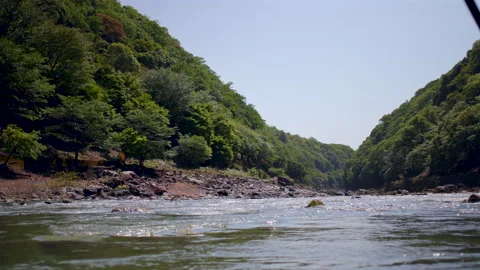 Water Level View Hozu River Surrounded by Cedar and Cypress - Kyoto, Japan Stock Footage 336830200