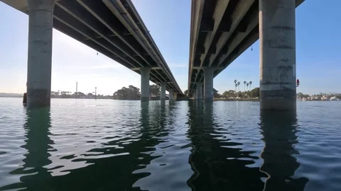 Water level view under bridge pillars Mission Bay San Diego CA Stock Footage 331608580